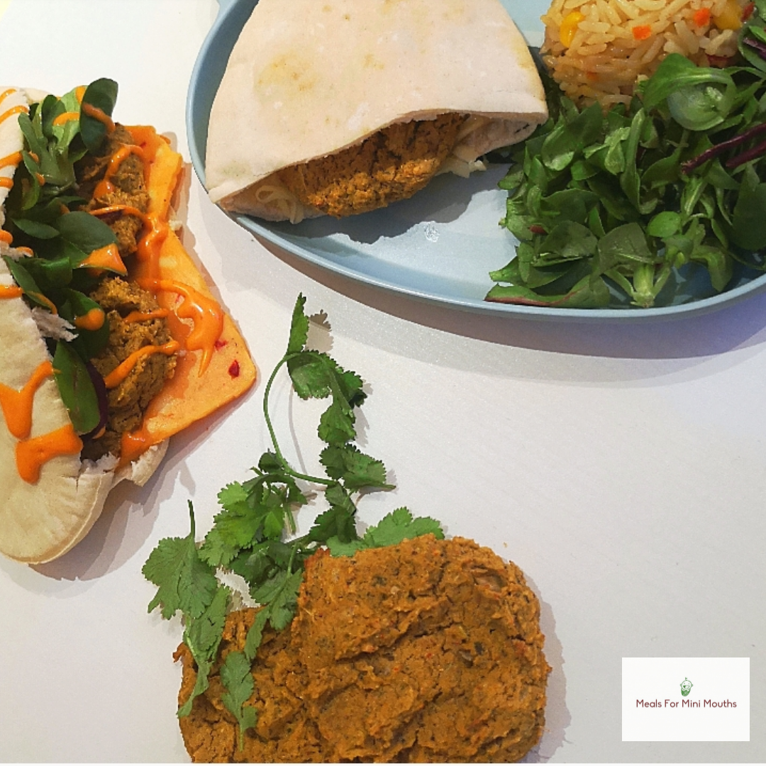 Baked falafel in pita bread with salad and rice, plus a large falafel patty and fresh coriander.