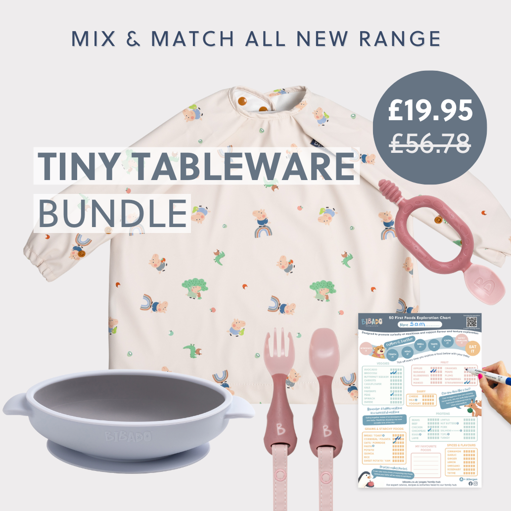 Bibado Tiny Tableware Weaning Set: cream bib with animal print, grey suction bowl, pink fork, spoon, and teether, plus a food chart. - Product image