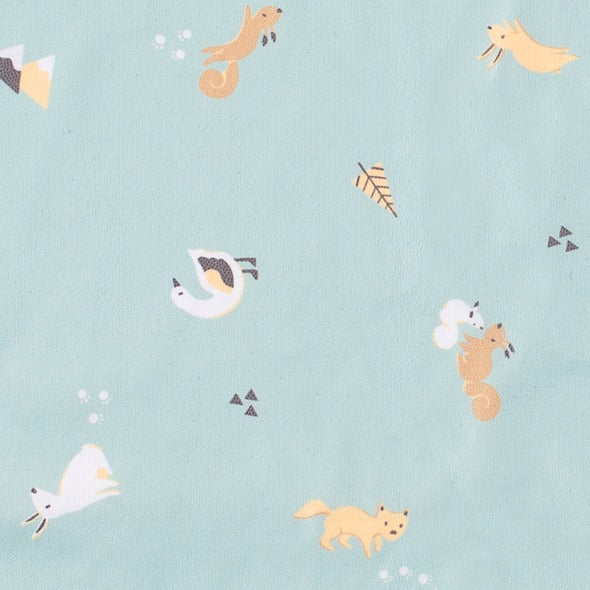 Light blue long-sleeve coverall fabric with playful squirrels, foxes, and birds print. - Product image