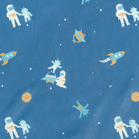 Blue long-sleeve coveralls with a playful space pattern of astronauts, aliens, rockets, and planets. - Product image