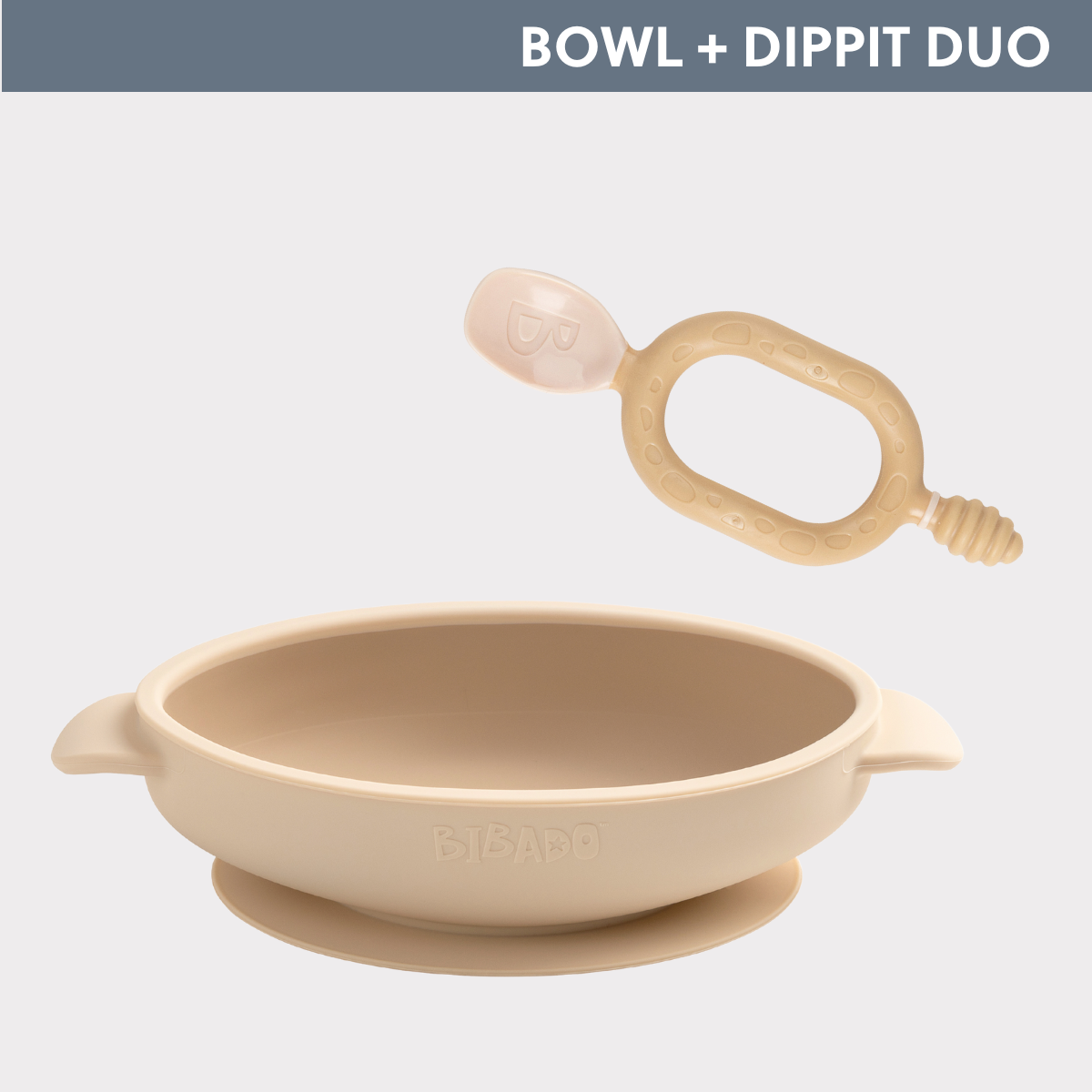 Beige silicone baby bowl with suction base and matching soft-tip spoon, both with "BIBADO" logo. - Product image