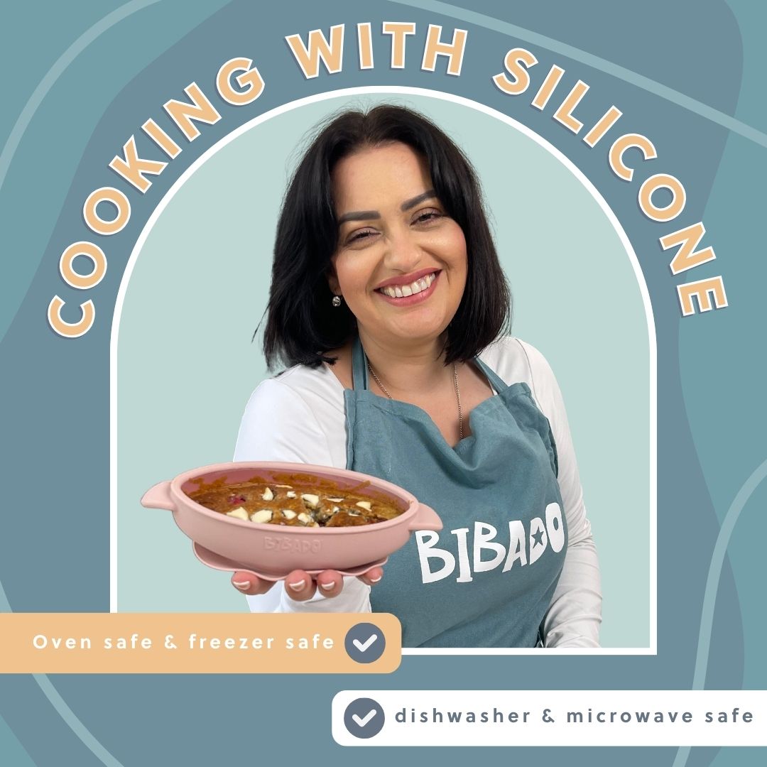 Smiling woman holding a pink silicone dish filled with baked oat breakfast fingers.