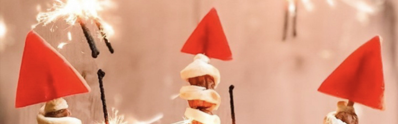 Sausage rockets with red paper fins and sparkling mini sparklers.