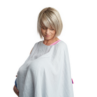 Woman using a light grey bamboo muslin Poppit On feeding cover, looking down at a baby (unseen). - Product image