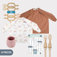 Baby Bear Bundle: brown and rainbow unicorn long-sleeve bibs, beige cutlery, pink cup, and weaning chart.