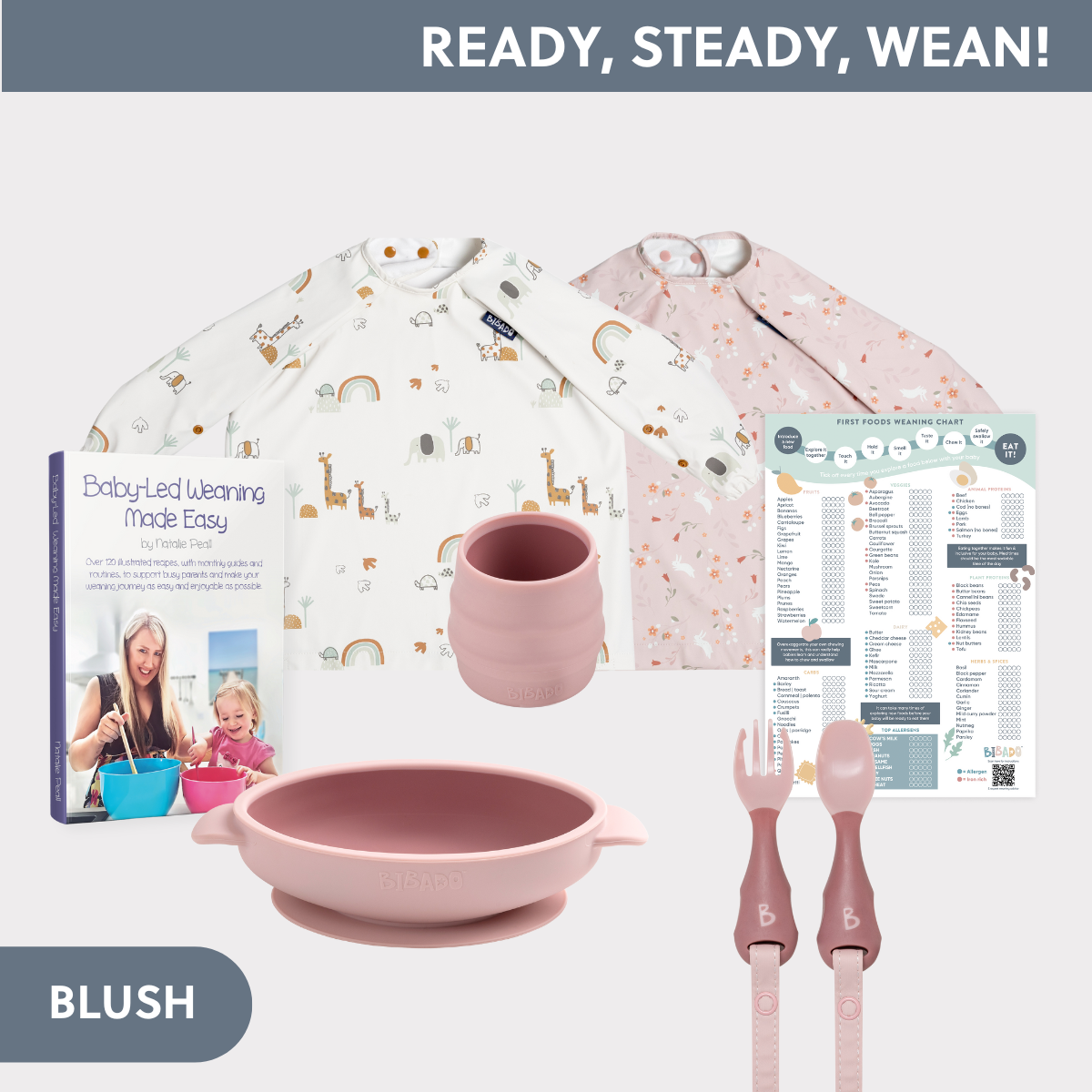 Blush pink silicone weaning set: bowl, cup, fork, spoon, plus two long-sleeve bibs with animal/rainbow prints, a recipe book, and a food chart. - Product image