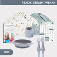 Baby-Led Weaning Bundle: book, two long-sleeve bibs (rainbow and dinosaur), grey silicone bowl, cup, and cutlery.