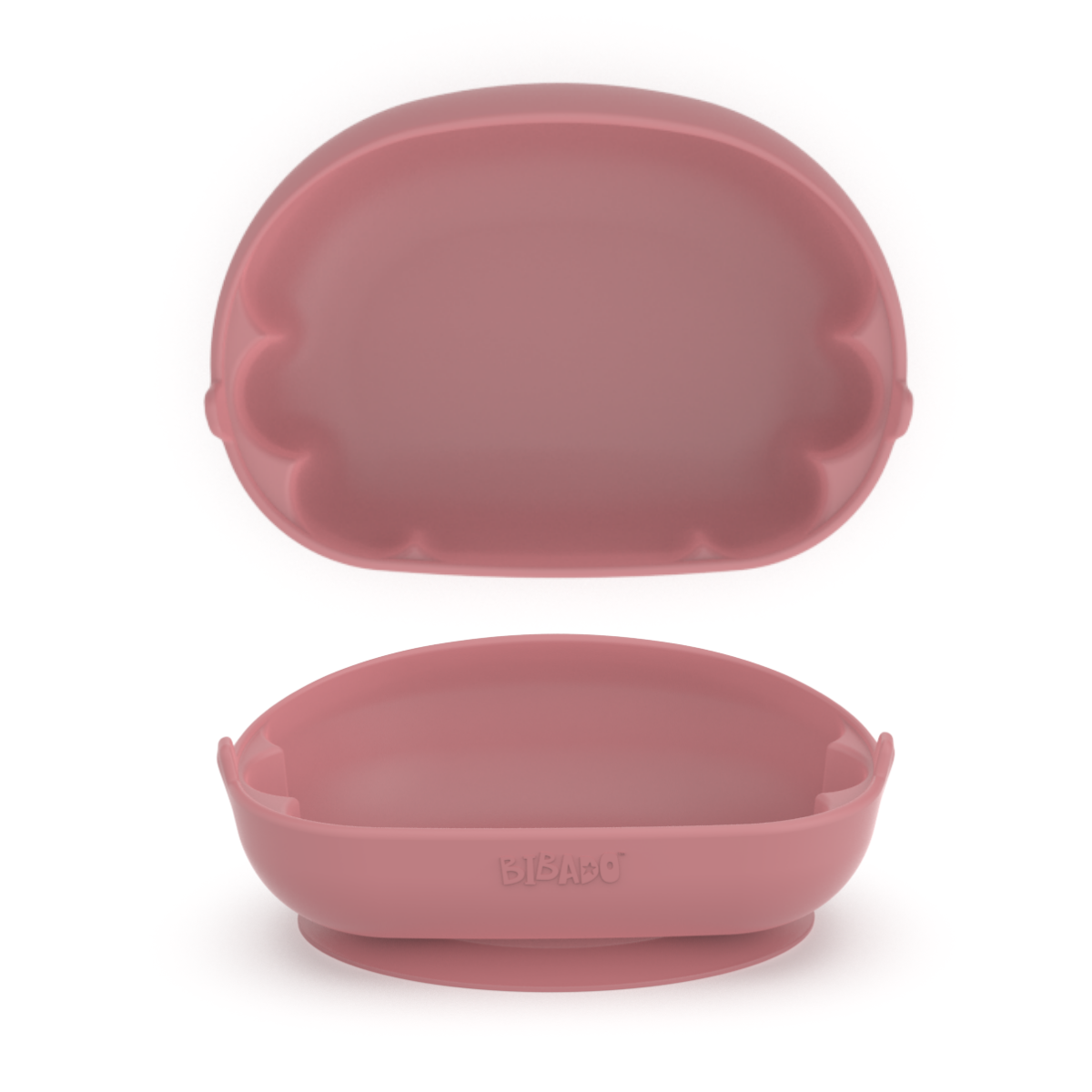 A pink silicone baby feeding bowl shown in two viewpoints, a birds-eye view showing the scalloped edges and a front-facing angle showing the tilted angle with a lower front. - Product image