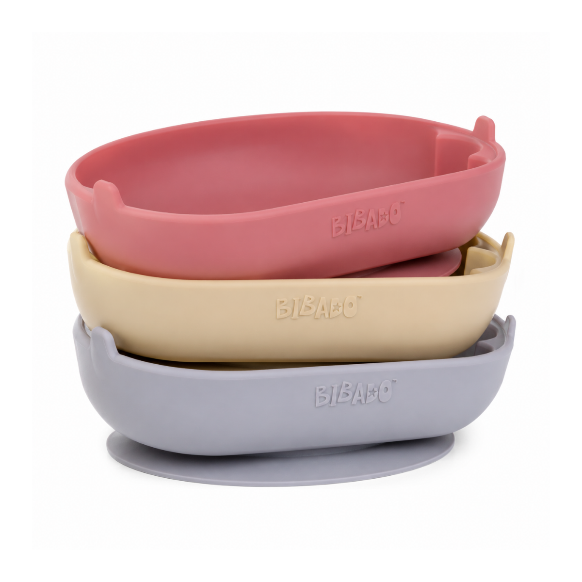 Three silicone baby feeding bowls stacked on a white background, featuring a dusty pink top bowl, a light beige middle bowl, and a light gray bottom bowl with suction cups. - product info image