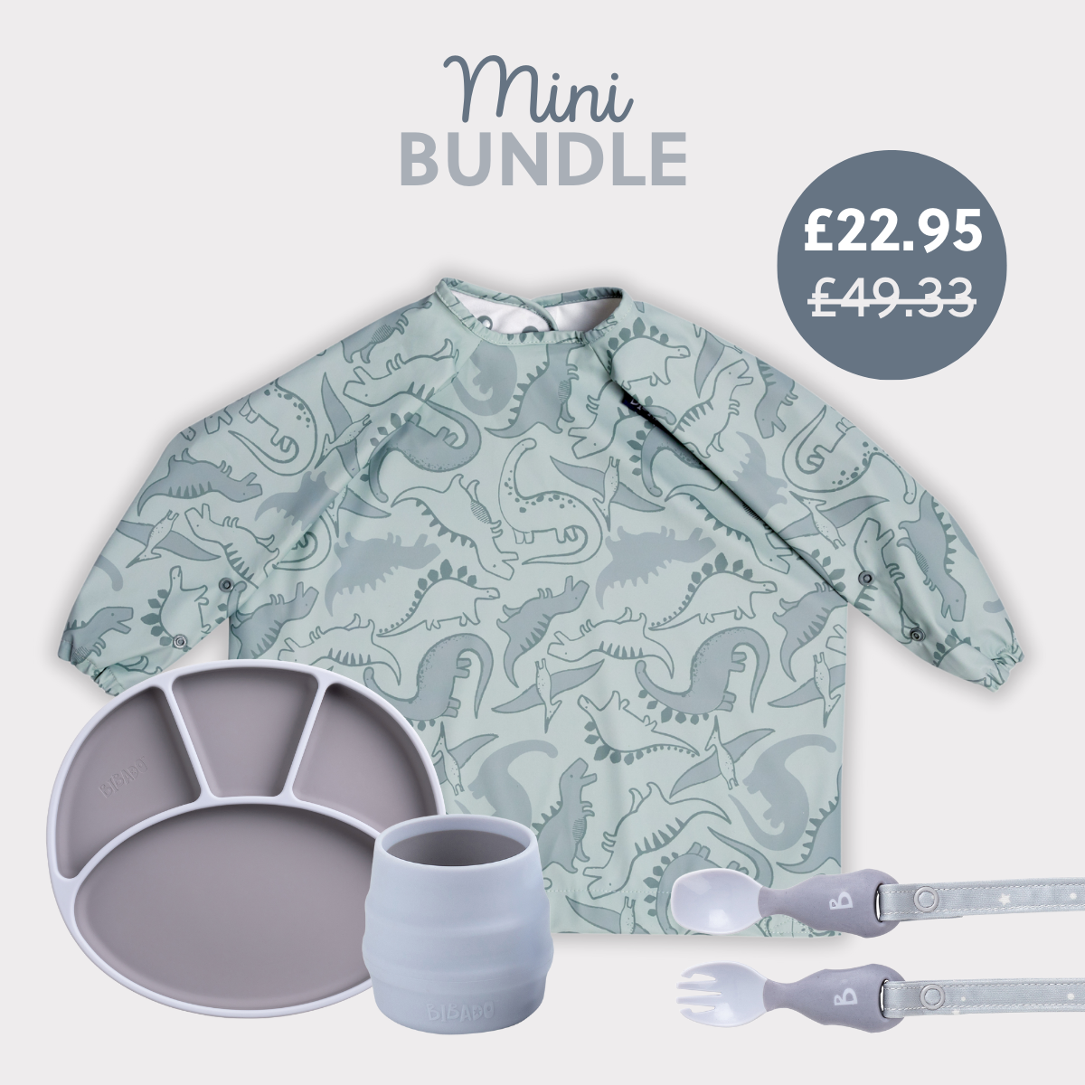 Sage green dinosaur print long-sleeve bib, grey silicone divided plate, light blue cup, and matching spoon/fork set. - Product image