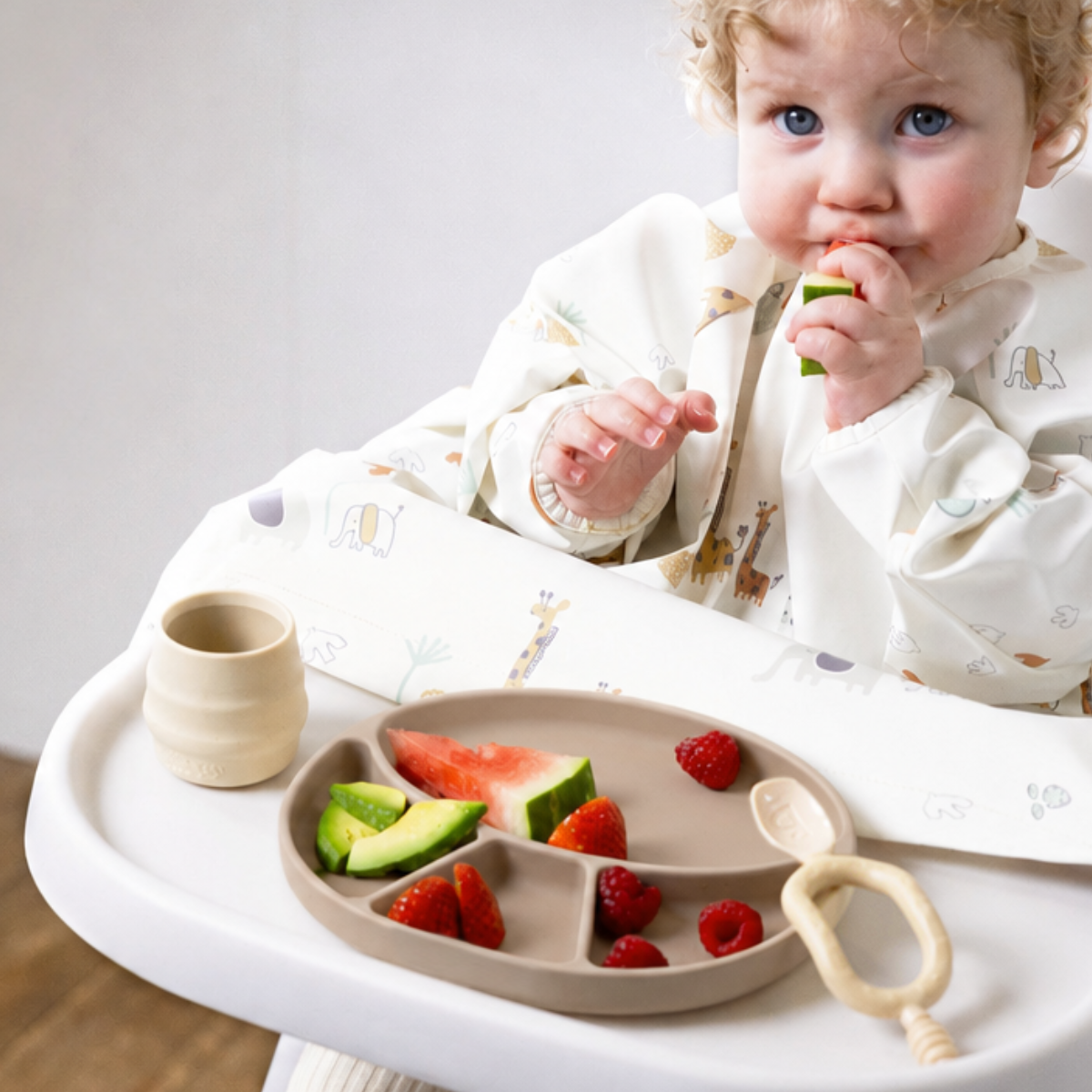 Three silicone plates in mist, blush, and fawn on a white background - Product image